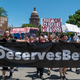 People protesting outside of the Texas State Capitol building.